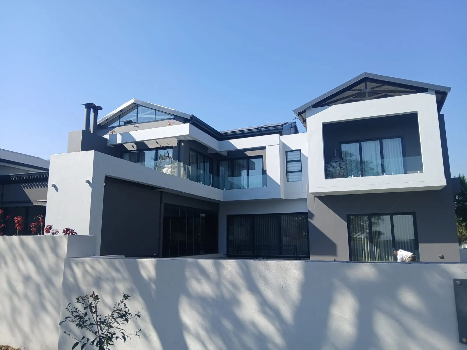 Double-storey house exterior before and after comparison - after