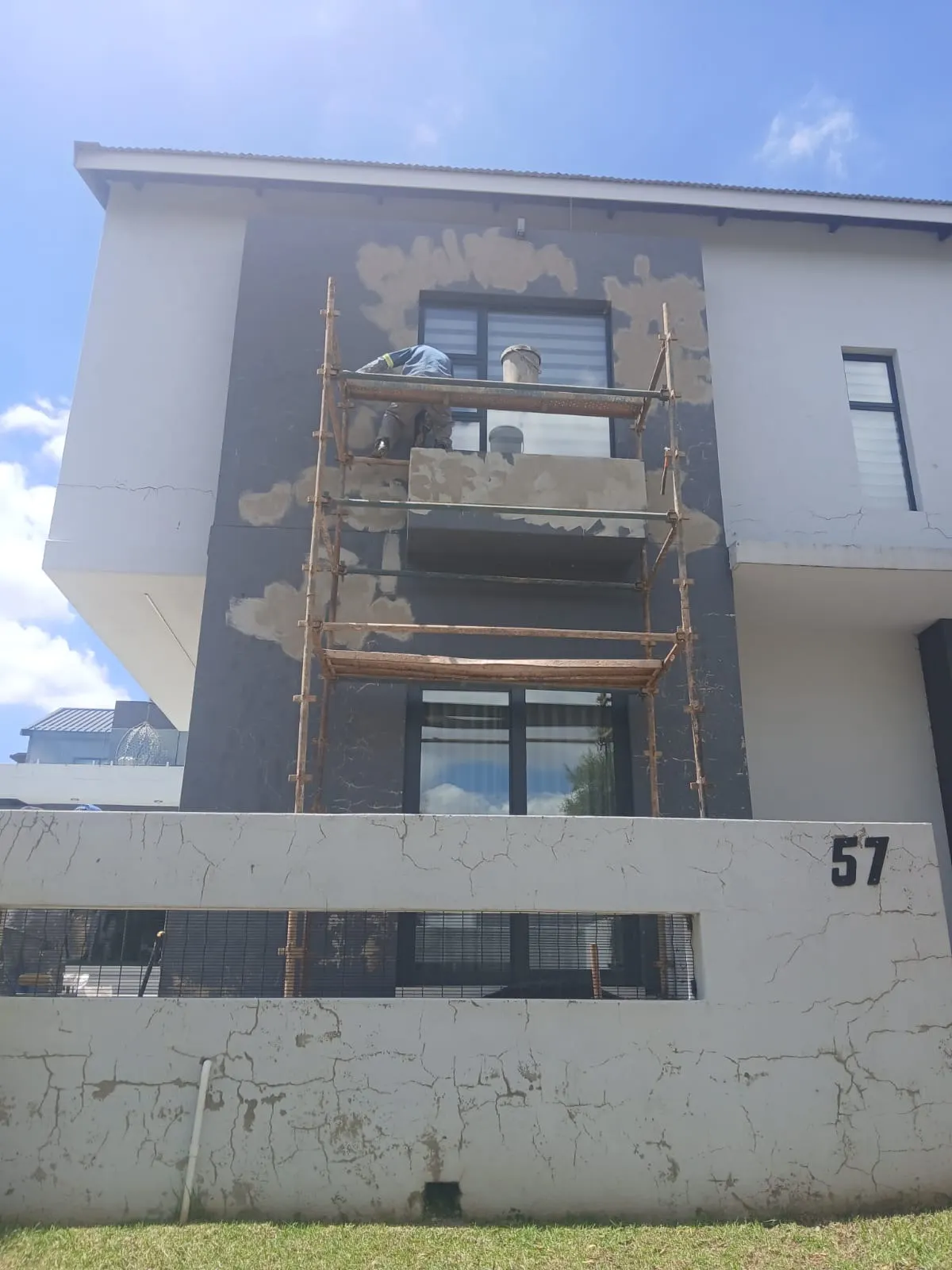 Double-storey house exterior before and after comparison - before
